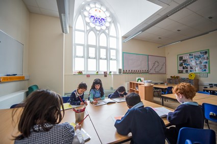 Reinstated stained glass windows bring light and colour to the refurbished classrooms of St Werburghs Primary